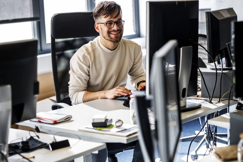 Man at desk working on a computer